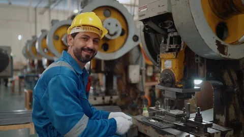 Worker smiles while operating heavy machinery Stock Footage 341651703