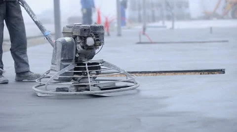Worker smoothes concrete surface Video stock 61917699