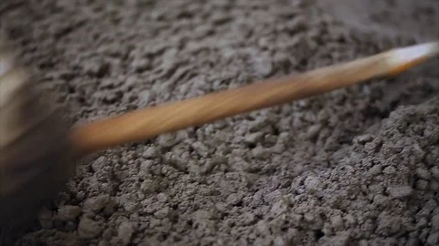 Worker smoothing concrete. Producing new concrete slab. Stock Footage 70208204