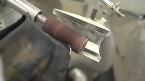 Worker smoothing prosthesis with sander in factory Stock Footage 236623479