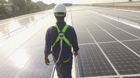 Worker on Solar Panels in the Sun Stock Footage 248783624