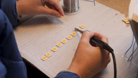 Worker soldering electronic components Stock Footage 279879323