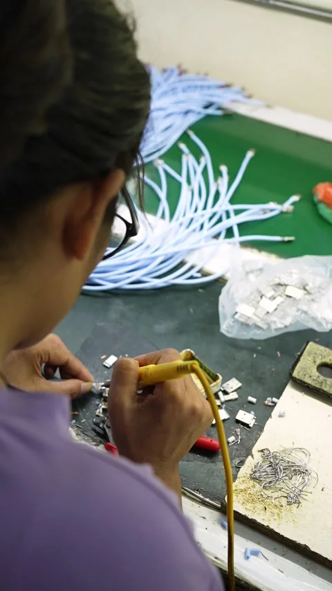 Worker Soldering Electronic Components in Noida Uttar Pradesh Factory Stock Footage 345810389