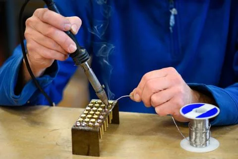 Worker soldering metal elements in close up Stock Photos