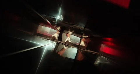 A worker in a special helmet welds parts. Smoke, flames and sparks reflect Video stock 166345308