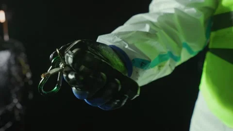 A worker in special protective clothing checks gas levels using a gas analyzer Stock Footage 286340482