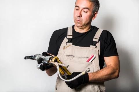 Worker specialist plumber, engineer or constructor on white background Stock Photos