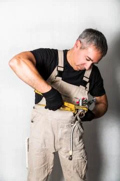 Worker specialist plumber, engineer or constructor on white background Stock Photos