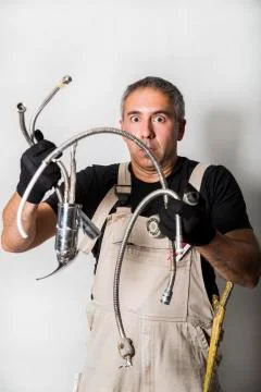 Worker specialist plumber, engineer or constructor on white background Stock Photos