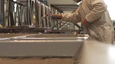 Worker spraying paints | slow motion Stock Footage 86054828
