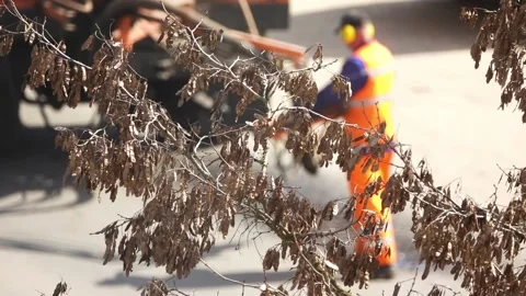 A worker sprays bitumen on the asphalt to correct defects on it. Road repairs Stock Footage 158025192