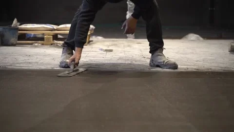 Worker Spreading Cement, Hand Held Stock Footage 167266491