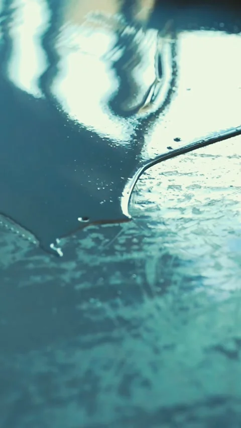 Worker spreading self-leveling epoxy resin on concrete floor Stock Footage 316672634
