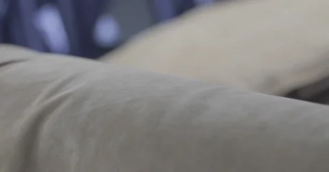 Worker stacks beige leather on pallets Stock Footage 79215611