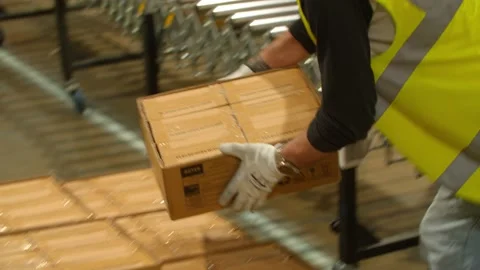 Worker stacks Packages in a Warehouse  스톡 동영상 131955676