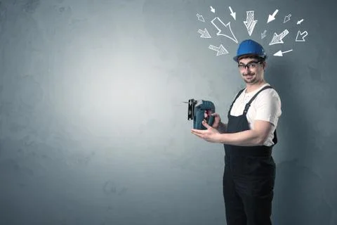 Worker standing with tool. Stock Photos