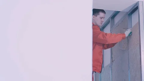 Worker stands on the stairs and fixes the insulator Stock Footage 77350248
