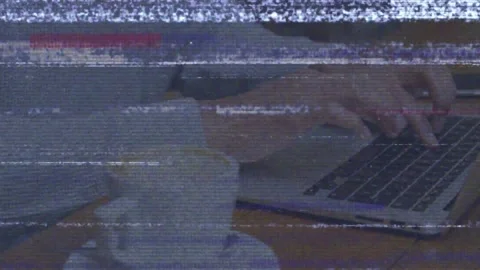 Worker starting tech work on laptop, typing, reaching phone while scan-line Stock Footage 333962725
