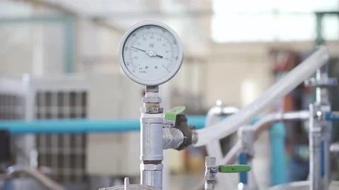 Worker starts Industrial Machine Pressure Gauge runs Video stock 248044686