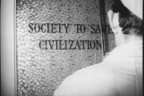 Worker stenciling Society to Save Civilization sign on door Stock Footage 90727592