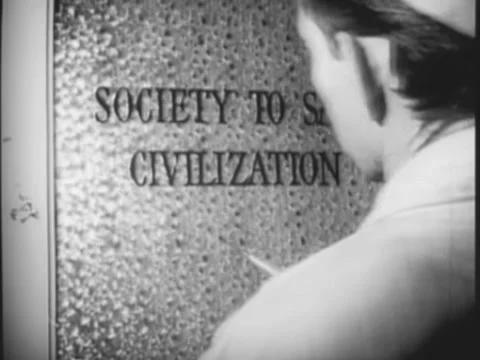 Worker stenciling Society to Save Civilization sign on door Stock Footage 260258422