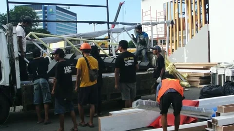 The worker is still working as a booth contractor at mining expo exhibition 스톡 동영상 290850734