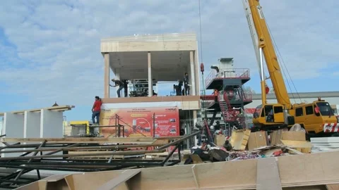 The worker is still working as a booth contractor at mining expo exhibition Stock Footage 290850758