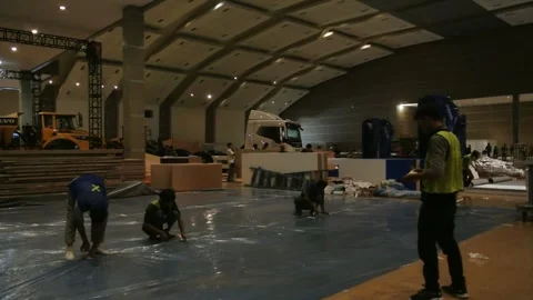 The worker is still working as a booth contractor at mining expo exhibition 스톡 동영상 290851988