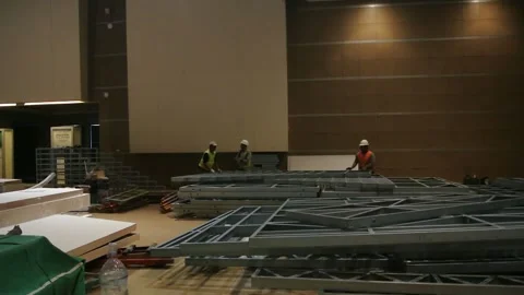  the worker is still working as a booth contractor at mining expo exhibition 스톡 동영상 290852048