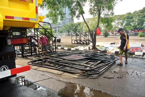 The worker is still working as a booth contractor at mining expo exhibition Stock Photos