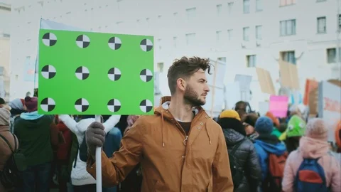 Worker strike. Man with blank banner. Background of crowd of people. Mock up 4k. Stock Footage 121983651