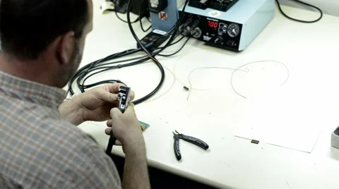 Worker stripping wire Stock-Footage 37022229