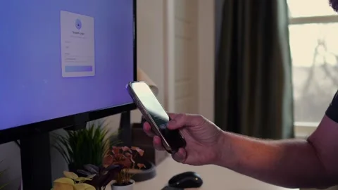 Worker Struggles with Two Factor Authentication Stock Footage 325458582