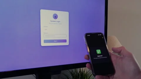 Worker Struggles with Two Factor Authentication Stock Footage 325458607