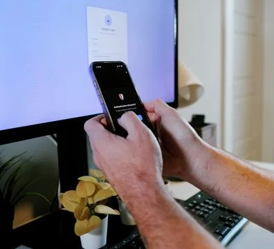 Worker Struggles with Two Factor Authentication Stock Photos