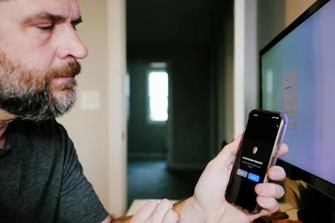 Worker Struggles with Two Factor Authentication Stock Photos