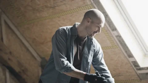Worker sweeping the floors of a construction site Stock Footage 149292620