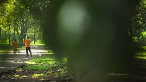Worker Sweeping Street with Broom Stock Footage 345551272