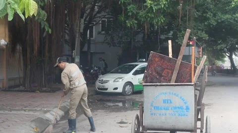 Worker sweeping the street Stock Footage 58625615