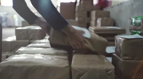 Worker takes a box in a warehouse. Close up Stock Footage 64103599