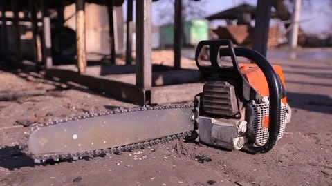 Worker takes a chainsaw Stock Footage 84172753