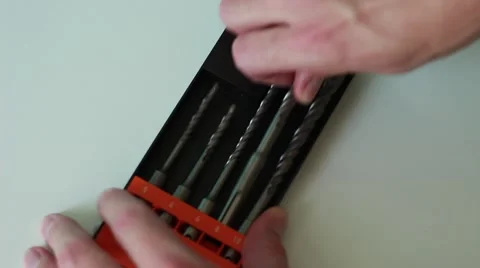 Worker takes a drill from the pack Vídeo Stock 65371195