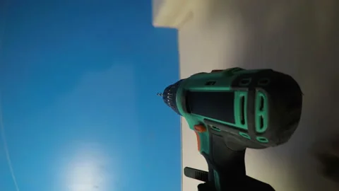 Worker Takes Drill From Table and Drills Several Holes in the Tree on Gopro 4K Stock Footage 93850009