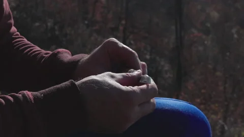 Worker takes out working knife out of his pocket Stock Footage 146918980