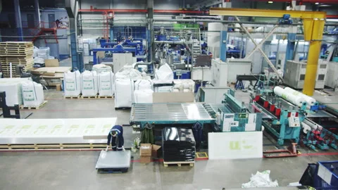 Worker takes polycarbonate sheet billet from conveyor belt Stock Footage 231224674