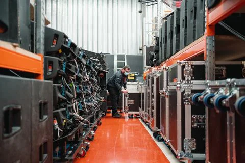 A worker taking a hard case to work in a pavilion Fotos de archivo