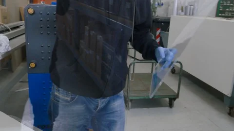 Worker taking measures to put plexiglas on the table - social distancing Stock-Footage 129594226