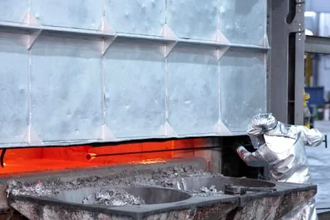 Worker taking a samples in an aluminum foundry Stock Photos