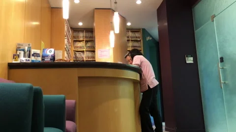 The worker talked to a dental receptionist for regular teeth scaling Video stock 256423385