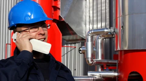 Worker talking on a mobile phone Stock Footage 993305